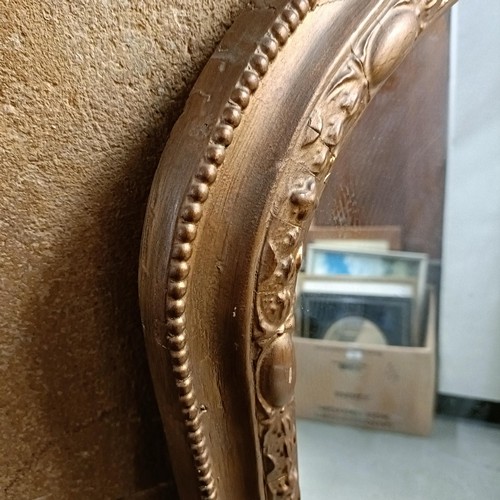 869 - A gilt gesso overmantel mirror, 190 x 149 cm