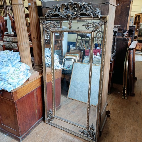 871 - A 19th century style gilt gesso rectangular mirror, with a shell finial, 180 x 92 cm