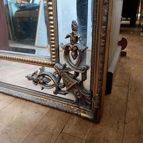 871 - A 19th century style gilt gesso rectangular mirror, with a shell finial, 180 x 92 cm