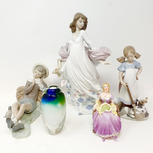 559 - A Lladro figure, girl with a basket, and three Caithness paperweights, and other figures (8)