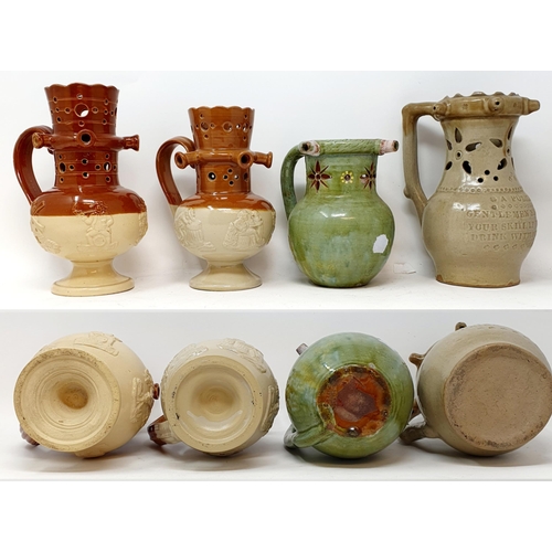 567 - A stoneware puzzle jug, with sprigged decoration, 22 cm high, and assorted other puzzle jugs (box)