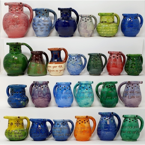 571 - An Art pottery puzzle jug and assorted puzzle jugs (box)