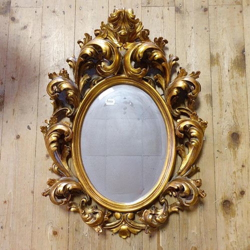 932 - A 19th century style gilt gesso wall mirror, 70 x 50 cm