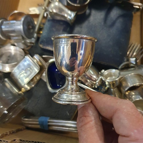 717 - A silver eggcup, a pair of binoculars, and assorted silver plate (box)