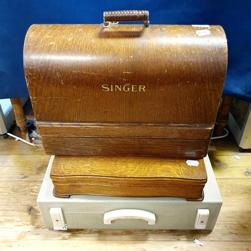 732 - ***Withdrawn*** A picnic set, a Singer sewing machine, and a canteen of cutlery (3)