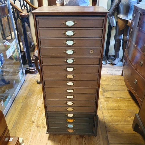 941 - A mahogany desk, 107 cm wide, a longcase clock, a filing chest, and a pedestal (4)