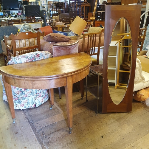 943 - A mahogany folding tea table, 116cm wide, and a wall mirror, 125 x 40cm (2)