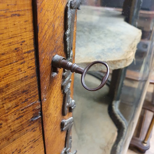 944 - A 19th century French serpentine front walnut display cabinet, with gilt metal mounts, 90 cm wide