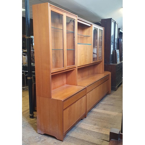 1064 - A large teak display cabinet by William Lawrence in sections