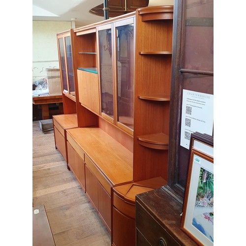 1064 - A large teak display cabinet by William Lawrence in sections