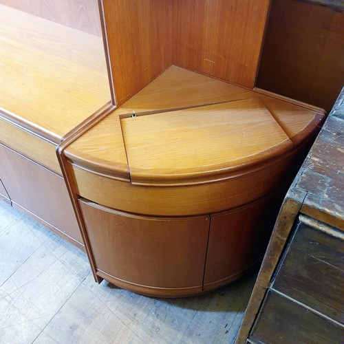 1064 - A large teak display cabinet by William Lawrence in sections