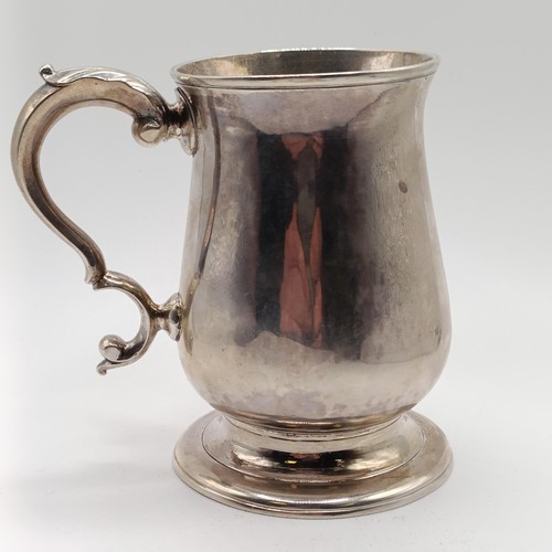 39 - A George III silver mug, of baluster form, makers mark IK, London 1744, 5.7 ozt, 9.5 cm high