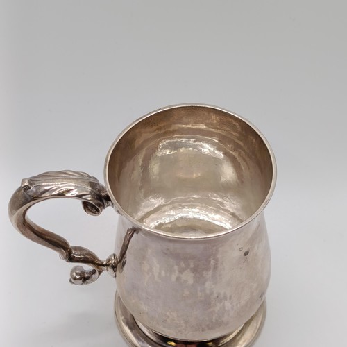 39 - A George III silver mug, of baluster form, makers mark IK, London 1744, 5.7 ozt, 9.5 cm high