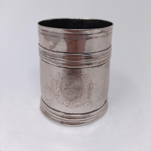 75 - A Queen Anne silver mug, circa 1710, 6.9 ozt, 9.5 cm high