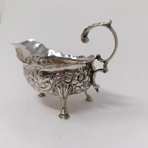 73 - A George III silver sauce boat, with embossed decoration, marks rubbed, probably London, 1761, 2.7 o... 