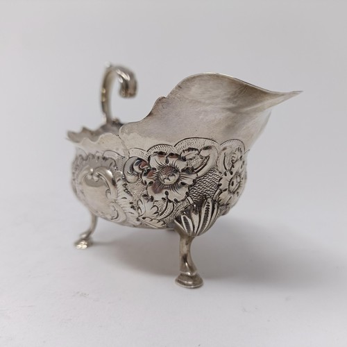 73 - A George III silver sauce boat, with embossed decoration, marks rubbed, probably London, 1761, 2.7 o... 