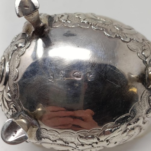 73 - A George III silver sauce boat, with embossed decoration, marks rubbed, probably London, 1761, 2.7 o... 