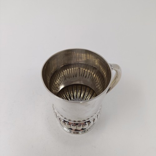 35 - A late Victorian silver christening mug, with a reeded lower body, London 1899, 5.2 ozt, 10 cm high