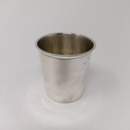 197 - An early 18th century provincial silver beaker, 7 cm high