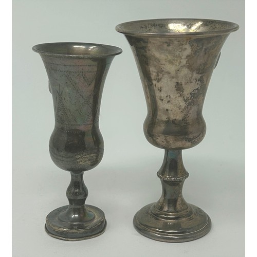 50 - A silver coloured metal kiddish cup, 10 cm high, and another (2)