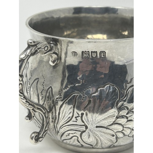 31 - A Charles II style silver porringer, embossed flowers and foliage, London 1913, 6.2 ozt, 7 cm high