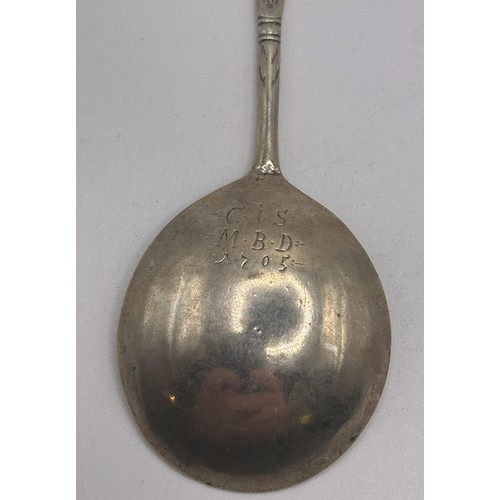 55 - An 18th century Scandinavian silver coloured metal spoon, initialled, dated 1705, with engraved deco... 