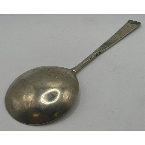 55 - An 18th century Scandinavian silver coloured metal spoon, initialled, dated 1705, with engraved deco... 