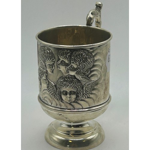 198 - An Edwardian silver christening mug, decorated cherub face masks, Chester 1911, 2.7 ozt, 10.5 cm hig... 