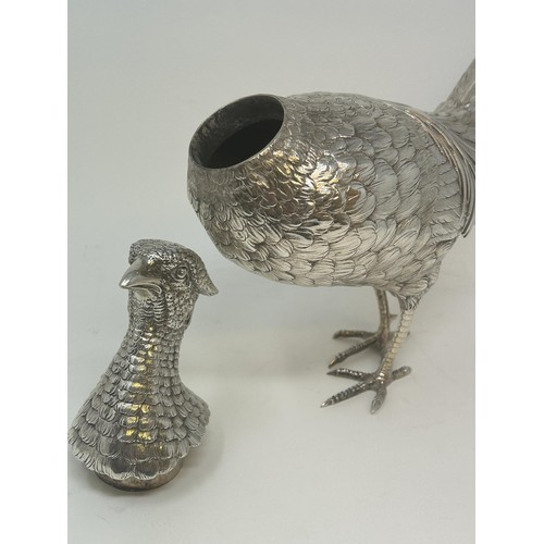 142 - A large and unusual decanter, in the form of a cock pheasant, import marks for London 1913, 33.3 ozt... 