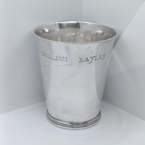 127 - An early 18th century silver tumbler cup, of tapering form, engraved William Bayley, marks indistinc... 