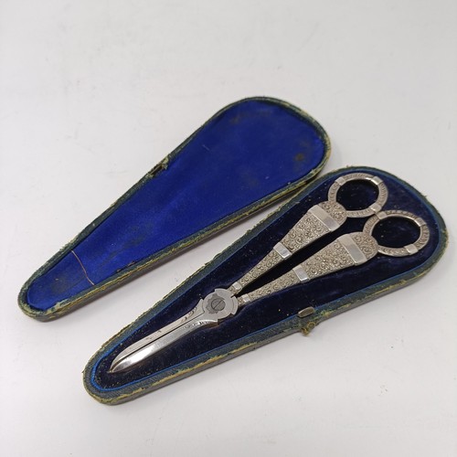 201 - A pair of Victorian silver grape scissors, Sheffield 1868, 3.3 ozt (all in), cased