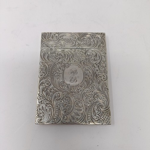 117 - A Victorian silver visiting card case, initialled, engraved a sailing boat and with acanthus leaf, 9... 