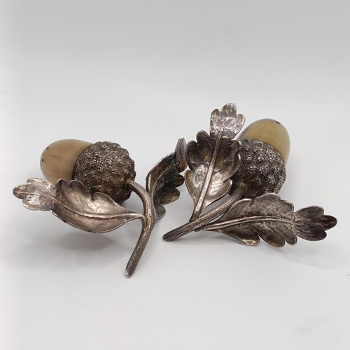 139 - A pair of silver and horn novelty acorn pepperettes, Sampson Morden & Co