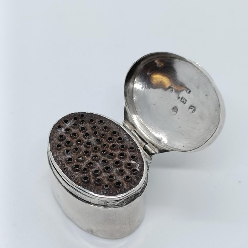 140 - An early 19th century oval silver nutmeg grater, Samuel Meriton, Birmingham 1807, 3.5 cm wide,