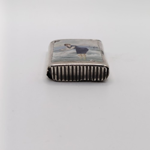 122 - A silver vesta case, decorated a lady bathing in the sea, marks indistinct, some damage, 4 cm