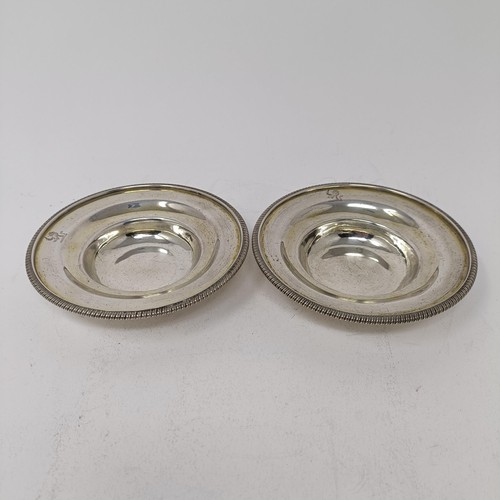 194 - A pair of George III silver dishes, crested, London 1806, 5.6 ozt, 12 cm diameter (2)