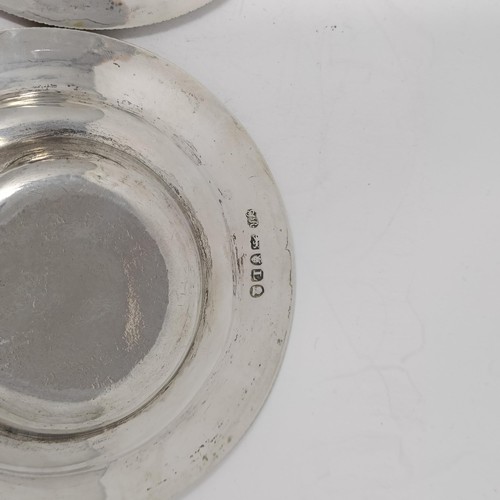 194 - A pair of George III silver dishes, crested, London 1806, 5.6 ozt, 12 cm diameter (2)