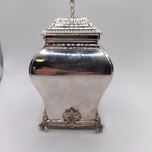 129 - A late Victorian silver tea caddy, of bombe form, decorated shells, West & Son, Dublin, London 1898,... 