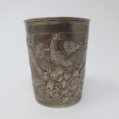 100 - A French silver beaker, embossed birds, ribbons and foliage, 8 cm high