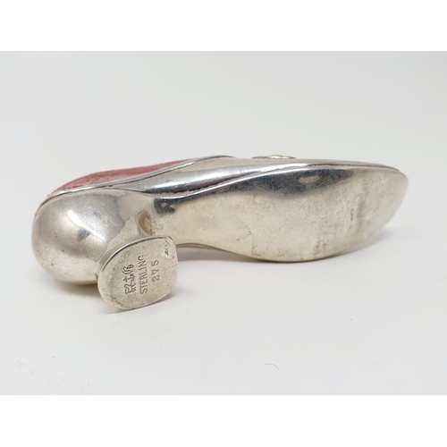 88 - A sterling silver pin cushion, in the form of a shoe, 3 cm high