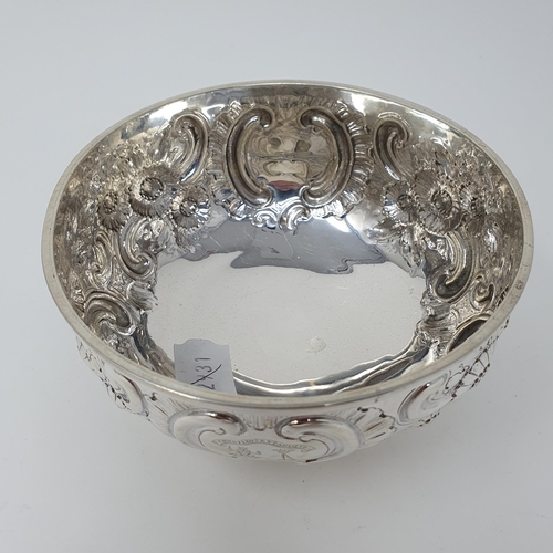 32 - A late Victorian silver bowl, crested, and embossed flowers and foliage, London 1890, 8 ozt, 13.5 cm... 