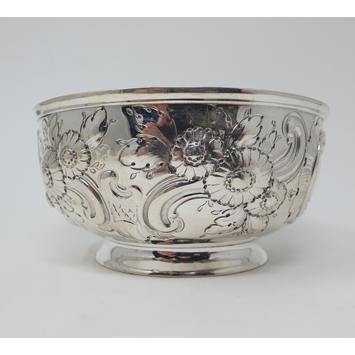 32 - A late Victorian silver bowl, crested, and embossed flowers and foliage, London 1890, 8 ozt, 13.5 cm... 