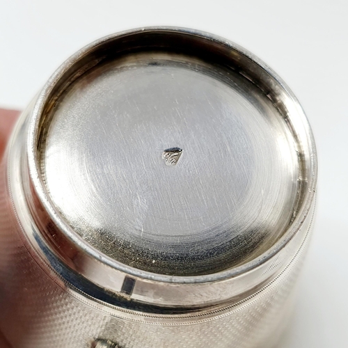 147 - A French silver coloured metal cup and saucer, monogrammed, and with engraved decoration, the saucer... 