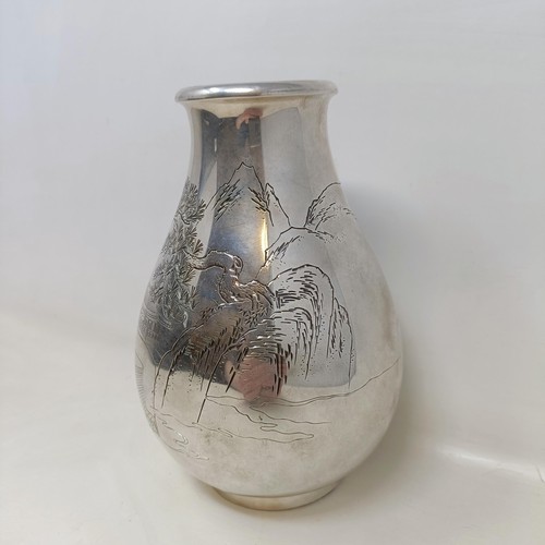 40 - A Japanese silver coloured metal vase, of baluster form, decorated a mountain scene, signed, 17.5 cm... 