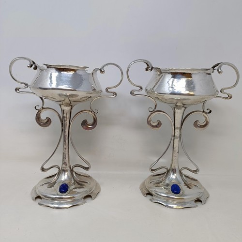 5 - A pair of Art Nouveau silver pedestal cups, applied blue cabochon stones, Mappin & Webb, Sheffield 1... 