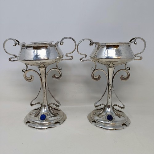 5 - A pair of Art Nouveau silver pedestal cups, applied blue cabochon stones, Mappin & Webb, Sheffield 1... 