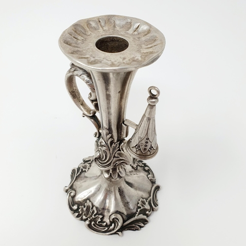 99 - An early 19th century silver taperstick, decorated foliage, with a snuffer, Sheffield 1839, 14 cm hi... 