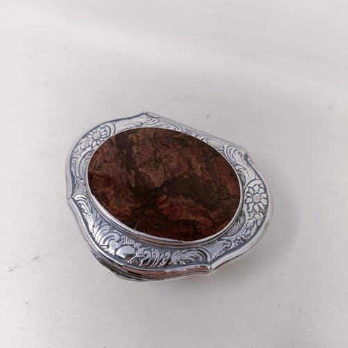 13 - A Continental silver coloured metal shaped box, top inset with a hardstone, and two silver boxes (3)