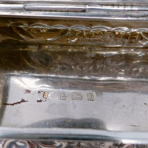 13 - A Continental silver coloured metal shaped box, top inset with a hardstone, and two silver boxes (3)