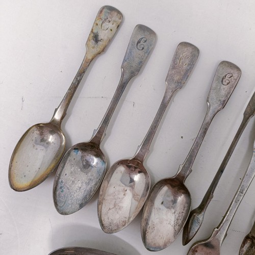 14 - A pair of silver sugar tongs, and assorted silver spoons, 9.4 ozt